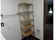 Metal storage rack in bathroom provides ample space for towels and bath items at 1722 N Parker Ave, Indianapolis, IN 46218