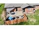 Aerial view showcases patio, fire pit, fenced yard, and lush green lawn at 1741 Terrace Ct, Franklin, IN 46131