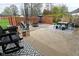 Inviting backyard patio area with ample seating and a shaded table setup, perfect for outdoor gatherings at 1741 Terrace Ct, Franklin, IN 46131