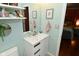 Bathroom featuring a clean vanity with a sink and mirror, complemented by stylish wall decor and neutral tones at 1741 Terrace Ct, Franklin, IN 46131