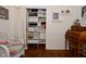 Bright bedroom featuring hardwood floors, ample closet space, and a cozy wicker chair at 1741 Terrace Ct, Franklin, IN 46131