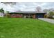 Charming red brick single-story home with a well-manicured green lawn at 1741 Terrace Ct, Franklin, IN 46131