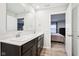 Bright bathroom showcases double sinks, quartz counters, and a connecting door to a bedroom at 1862 Downey Ln, Greenfield, IN 46140