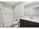 Well-lit bathroom with a shower and tub combination, accompanied by a modern vanity and sink at 1862 Downey Ln, Greenfield, IN 46140