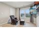 Comfortable bedroom with seating, large window, and tv at 1862 Downey Ln, Greenfield, IN 46140