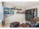 Comfortable bedroom with seating, storage shelves, large TV, and large window at 1862 Downey Ln, Greenfield, IN 46140