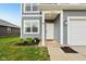 Inviting entryway with white door, stylish house number, and green landscaping, enhancing curb appeal at 1862 Downey Ln, Greenfield, IN 46140