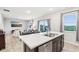 Open-concept kitchen with stainless steel appliances and a large island perfect for entertaining at 1862 Downey Ln, Greenfield, IN 46140