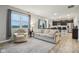 Spacious living room open to kitchen featuring modern furnishings, lots of natural light, and neutral decor at 1862 Downey Ln, Greenfield, IN 46140