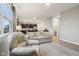 Spacious living room showcasing an open layout to the kitchen, great natural light, and modern decor at 1862 Downey Ln, Greenfield, IN 46140