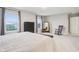Spacious main bedroom features two large windows for ample natural light, a rocking chair, and a dark wood dresser at 1862 Downey Ln, Greenfield, IN 46140