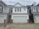 New two-story home with white siding and a two-car garage nestled in a vibrant community at 18745 Moray St, Westfield, IN 46074