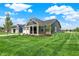 A beautiful home with a well-manicured lawn and newly planted trees in the yard at 19113 River Jordan Pass, Westfield, IN 46074