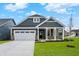 Charming home with a two-car garage, well-manicured lawn, and appealing stone accents at 19113 River Jordan Pass, Westfield, IN 46074