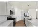 Modern kitchen featuring stainless steel appliances, gray cabinetry, and a central island with pendant lighting at 19113 River Jordan Pass, Westfield, IN 46074