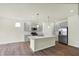 Modern kitchen featuring stainless steel appliances, gray cabinetry, and a central island with pendant lighting at 19113 River Jordan Pass, Westfield, IN 46074