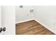 A functional laundry room featuring wood-look flooring and hookups for a washer and dryer at 19113 River Jordan Pass, Westfield, IN 46074