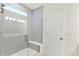Modern shower with glass enclosure, bench, and a tiled surround at 19113 River Jordan Pass, Westfield, IN 46074