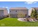 Spacious backyard with lush green lawn and a charming stone patio area for relaxing at 19546 Forsythe Dr, Noblesville, IN 46060