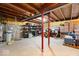 Unfinished basement with exposed beams, concrete floor, and storage shelves at 19546 Forsythe Dr, Noblesville, IN 46060