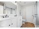 Bathroom with granite vanity with double sinks, glass shower, and separate toilet at 19546 Forsythe Dr, Noblesville, IN 46060