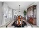 Formal dining room featuring a chandelier, large windows, and hardwood flooring at 19546 Forsythe Dr, Noblesville, IN 46060