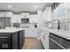 The modern kitchen includes stainless steel appliances, mosaic backsplash, and a large island at 19546 Forsythe Dr, Noblesville, IN 46060