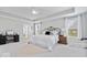 Spacious main bedroom with trey ceilings, and matching sitting chairs at 19546 Forsythe Dr, Noblesville, IN 46060