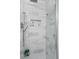 Modern shower with glass door, marble tile, and built in shelf with soap at 19546 Forsythe Dr, Noblesville, IN 46060