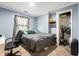 Bedroom with neutral carpet, large window, and closet space for storage at 20892 Overdorf Rd, Noblesville, IN 46062