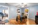 Cozy dining room with natural light, vinyl floors, and access to the kitchen and living areas at 20892 Overdorf Rd, Noblesville, IN 46062