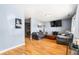 Cozy living area with hardwood floors, soothing blue walls, and inviting sofas, perfect for relaxation and entertainment at 20892 Overdorf Rd, Noblesville, IN 46062