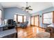 Bright living room with natural light from windows, neutral walls, ceiling fan and vinyl flooring at 20892 Overdorf Rd, Noblesville, IN 46062