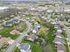 Wide aerial view of a residential area with mature landscaping, varied homes, and nearby amenities at 24 W Pine Ridge Dr, Westfield, IN 46074