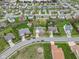 Aerial view of a neighborhood with well-maintained lawns, mature trees, and varied home styles at 24 W Pine Ridge Dr, Westfield, IN 46074