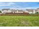 A fenced-in backyard features a spacious lawn area with neighboring houses at 24 W Pine Ridge Dr, Westfield, IN 46074