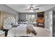 Comfortable bedroom with a ceiling fan, fireplace, and TV at 24 W Pine Ridge Dr, Westfield, IN 46074