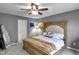 Serene bedroom with wood-framed bed, soft lighting, and neutral gray walls at 24 W Pine Ridge Dr, Westfield, IN 46074
