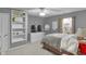 Bedroom featuring a queen-sized bed, carpet flooring, and a large flat screen TV at 24 W Pine Ridge Dr, Westfield, IN 46074