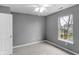 Bedroom featuring a large window, a ceiling fan, and carpet flooring throughout at 24 W Pine Ridge Dr, Westfield, IN 46074