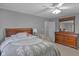 Inviting bedroom featuring a wood dresser with mirror and ceiling fan at 24 W Pine Ridge Dr, Westfield, IN 46074