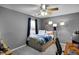 Bedroom featuring a ceiling fan, a full-sized bed, and large window letting in natural light at 24 W Pine Ridge Dr, Westfield, IN 46074