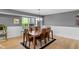 Elegant dining room featuring hardwood floors, a large window, and a stylish chandelier at 24 W Pine Ridge Dr, Westfield, IN 46074
