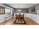Bright dining room with hardwood floors, a large window, and a neutral color palette at 24 W Pine Ridge Dr, Westfield, IN 46074