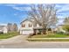 Charming two-story home with a well-maintained lawn and a mature tree in the front yard at 24 W Pine Ridge Dr, Westfield, IN 46074