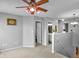 Upstairs hallway leading to the bathroom with neutral paint, carpet, and updated lighting fixtures at 24 W Pine Ridge Dr, Westfield, IN 46074