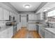 Bright kitchen with white cabinetry, stainless steel appliances, and durable countertops at 24 W Pine Ridge Dr, Westfield, IN 46074