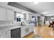 Bright kitchen view into dining area featuring stainless steel appliances and white cabinets at 24 W Pine Ridge Dr, Westfield, IN 46074