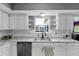 Bright kitchen with a stainless steel sink, updated countertops and white cabinets at 24 W Pine Ridge Dr, Westfield, IN 46074