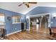 Cozy living room with wood floors, a ceiling fan, and natural light at 24 W Pine Ridge Dr, Westfield, IN 46074